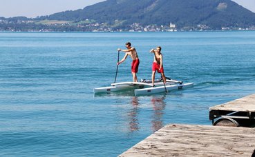  stand up paddling on a catamaran